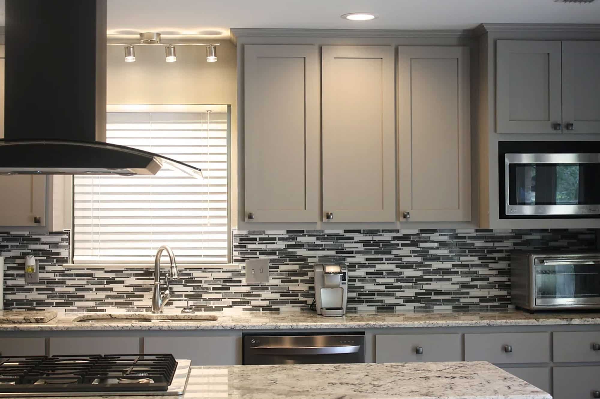 a large kitchen with stainless steel appliances